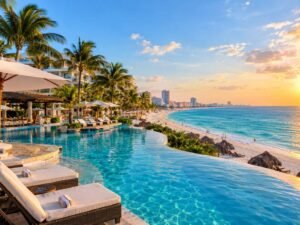 Luxury beachfront resort in Cancun Mexico with a large pool