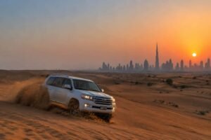 Tourists enjoying a thrilling quad bike ride on the sand dunes during a Dubai Desert Safari tour.