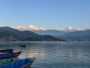 Scenic view of Phewa Lake in Pokhara with the Annapurna Himalayas, a popular quick holiday from Dubai to Nepal
