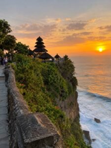Sunset view of Uluwatu Temple on a steep cliff in Bali taken from smartphone